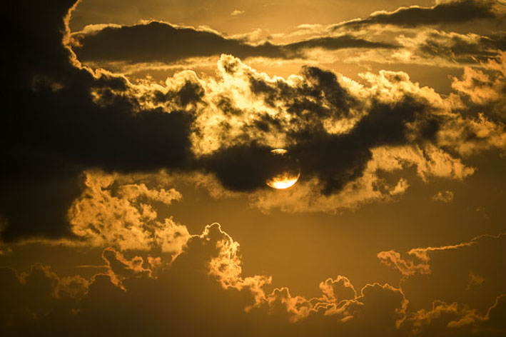 Sun behind clouds